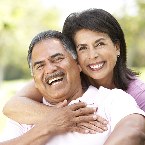 woman smiling at dentist teeth cleaning